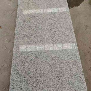 郴州芝麻白光面毛板